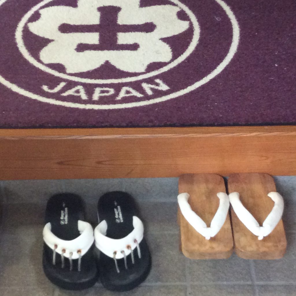 Welcome home mat and Kancho's sandals at his Izu dojo, Japan